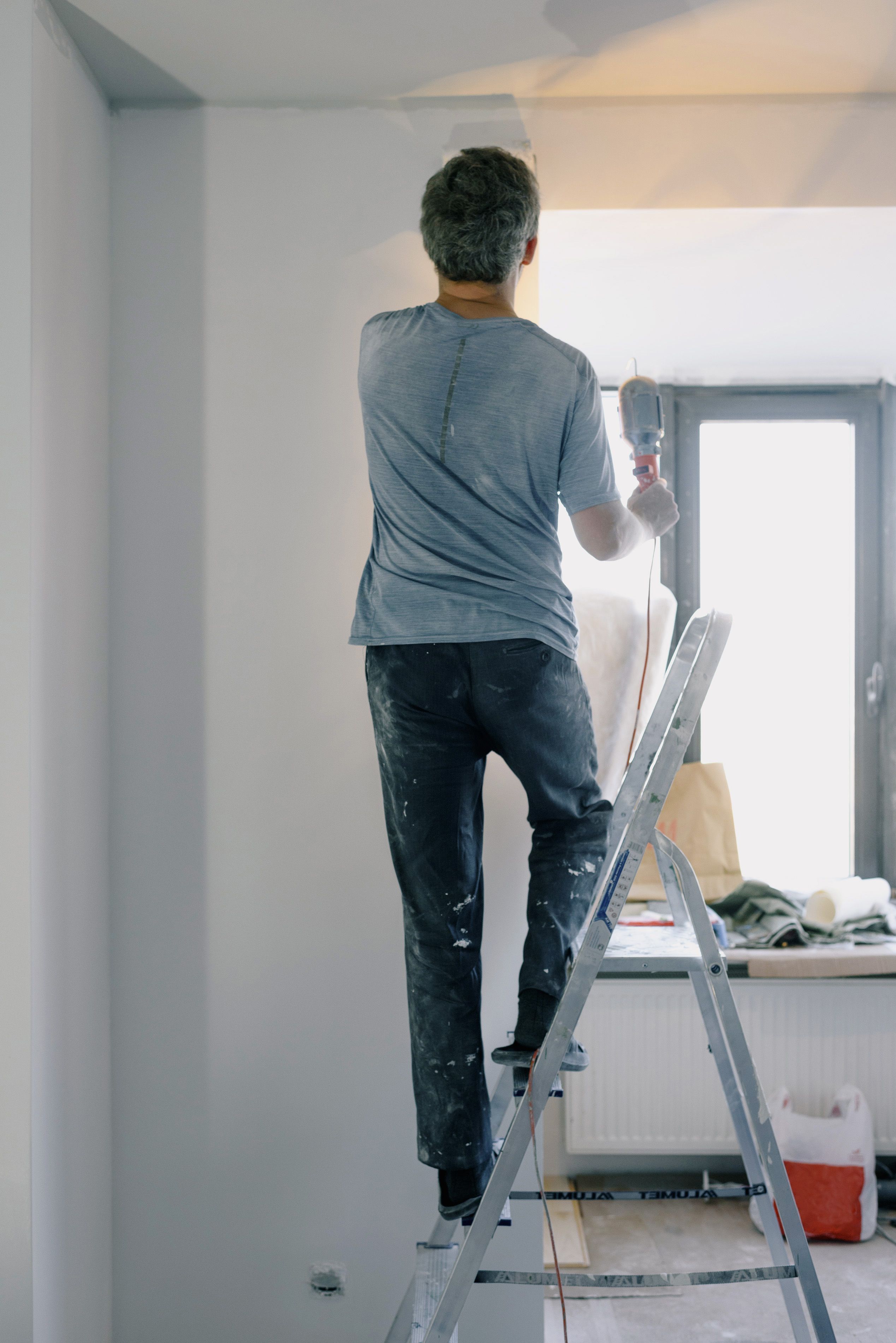 Handyman completing fixture installation